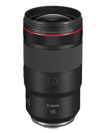 Canon RF 135mm f/1.8 L IS USM telephoto prime lens standing upright, front glass and red ring visible