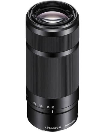 Sony E 55-210mm f/4.5-6.3 OSS telephoto zoom lens standing upright, showing zoom markings and focus rings