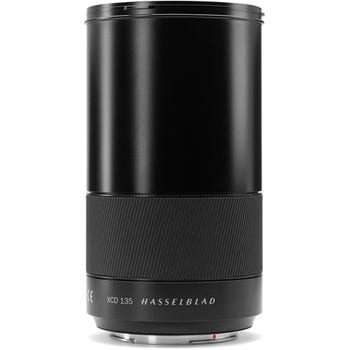 Hasselblad XCD 135mm f/2.8 medium format lens standing upright, side view showing focus ring and branding