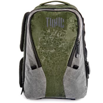 Toxic Valkyrie Medium Emerald camera backpack, front view with green panel and grey sides