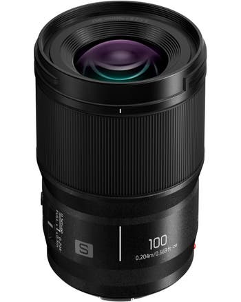 Panasonic Lumix S 100mm f/2.8 Macro Lens standing upright, showing front glass and focus ring