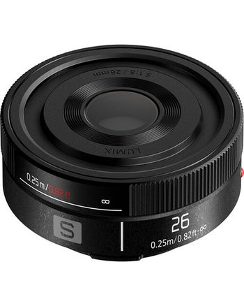 Panasonic LUMIX S 26mm f/8 pancake lens, top angled view showing compact, ultra-thin design and focus markings