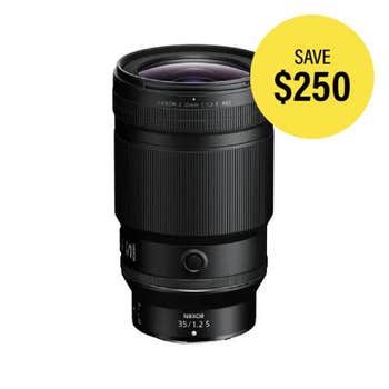 Nikon NIKKOR Z 50mm f/1.2 S Lens standing upright, front angled view showing focus ring and OLED display