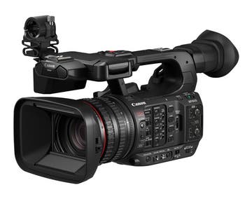 Canon XF605 UHD 4K HDR Pro Camcorder front-right view showing 15x L-series zoom lens and control panel.