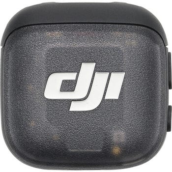 Front view of DJI Mic 3 wireless clip-on transmitter with DJI logo on the casing