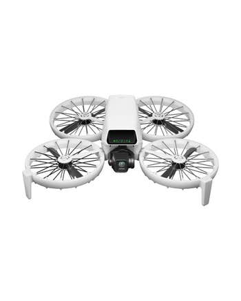 DJI Flip Drone front view showing four circular guarded propellers and built-in camera