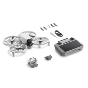 DJI Flip drone kit with foldable propeller guards, DJI RC 2 controller, cables, tools and accessories on white background
