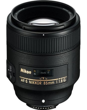 Nikon AF-S NIKKOR 85mm f/1.8G FX-format prime lens, front view showing focus scale and controls