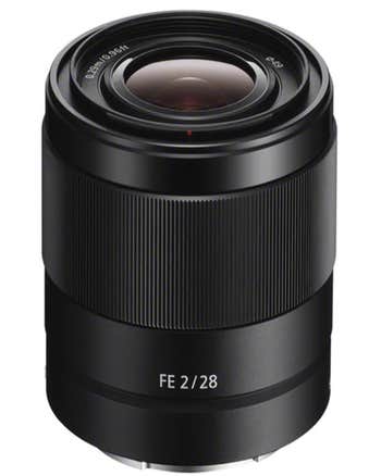 Sony FE 28mm f/2 full-frame E-mount prime lens, angled view showing compact black barrel and front element