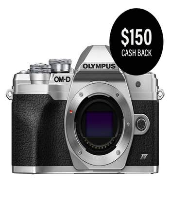 Olympus OM-D E-M10 Mark IV silver camera body front view with $150 cashback badge