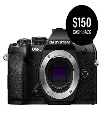 Front view of black OM System OM-5 Mark II mirrorless camera body with $150 cash back badge.