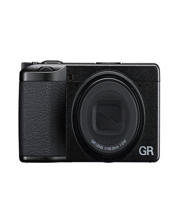 Front view of Ricoh GR IV compact camera with 18.3mm f/2.8 GR lens retracted
