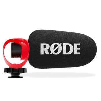 Rode VideoMicro II shotgun microphone with foam windshield and HELIX red isolation mount, side view
