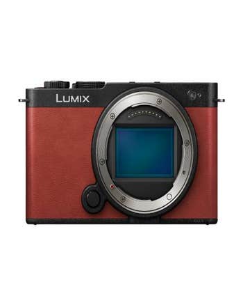 Front view of Panasonic LUMIX S9 compact full frame mirrorless camera body in crimson red, no lens attached