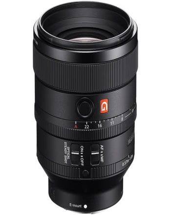 Sony FE 100mm f/2.8 STF GM OSS lens front angle showing aperture ring and control switches