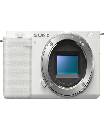 Front view of Sony ZV-E10 mirrorless camera body in white, showing E-mount sensor and textured grip