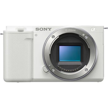 Front view of Sony ZV-E10 mirrorless camera body in white, showing E-mount sensor and textured grip