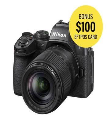 Nikon Z50 II mirrorless camera with attached DX 18-140mm f/3.5-5.6 VR zoom lens, front angled view