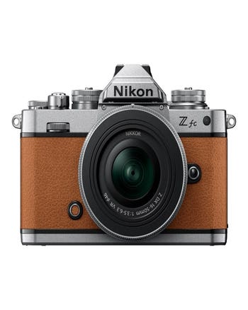 Front view of Nikon Z fc brown mirrorless camera with NIKKOR Z DX 16-50mm VR lens attached.