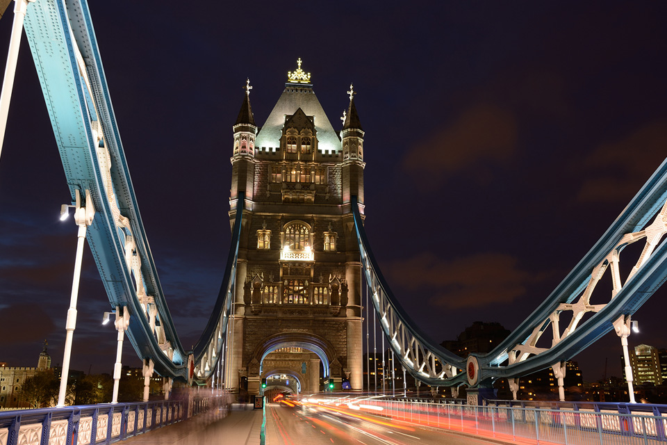 Car trails on London’s Tower Bridge at night, photographed with the Nikon 18-140mm lens