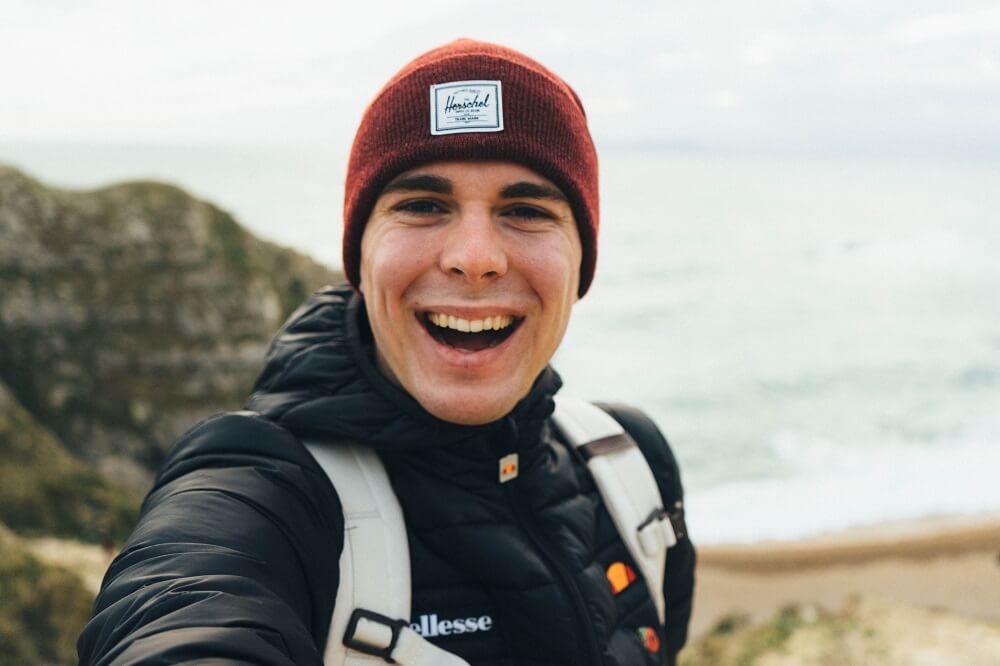 Man taking a vlog by the beach