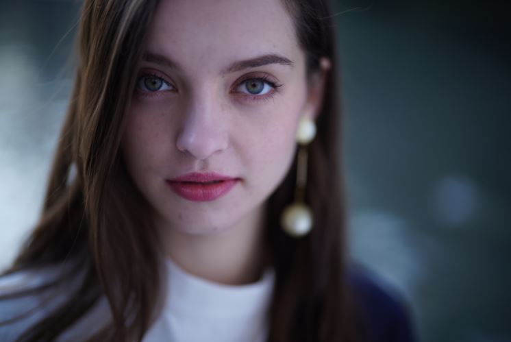 Close-up of young woman with hazel eyes and long brown hair, photographed with the Sony FE 50mm f1.2 GM lens